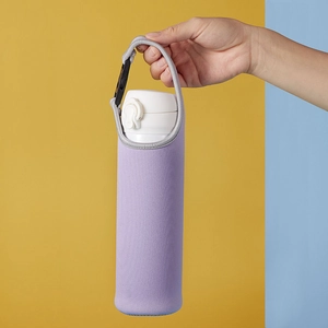 Detail of purple neoprene water bottle sleeve with grey handle and black carabiner