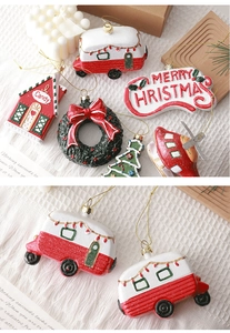 Detailed close-up of festive resin Christmas ornaments with gold hanging strings