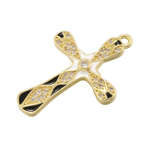 Detailed close-up of a gold cross pendant featuring sparkling zircons and enamel accents