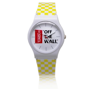 Close-up of a white quartz watch featuring a yellow checkerboard pattern strap and red hands