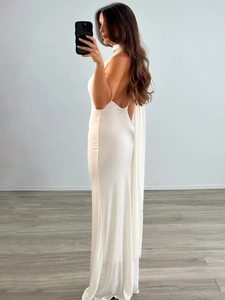 Elegant white backless halter maxi dress with flowing silhouette for summer parties