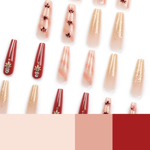Autumn red press-on nails with maple leaf sequins, rhinestones and marble patterns