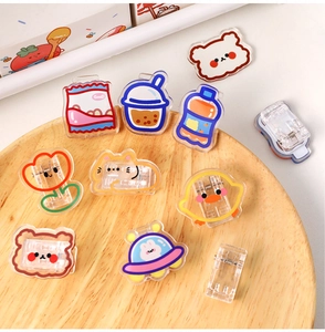 Cute acrylic snack clips in various cartoon shapes including animals and food