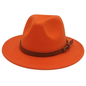 Detail of orange wool felt fedora hat featuring a brown leather band and metal buckle