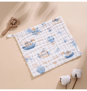 Detail of 100% cotton baby gauze towel with cartoon submarine print and textured bubble gauze