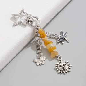 Silver star keychain with yellow turquoise stone and dragonfly butterfly sun pendants