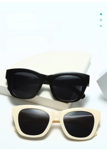 Fashionable square frame oversized sunglasses shown in classic black and cream beige