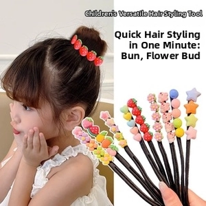 Detail of pink Y2K style children's hair accessories for bun and ponytail styling