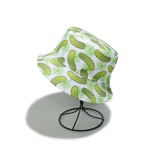 Detail of white cotton bucket hat featuring all-over green pickle print on metal stand