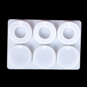 Detailed view of 6-cavity translucent silicone mold for DIY round pendant jewelry making