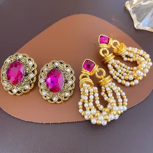 Vintage rose red gemstone earrings with pearl tassels and gold filigree accents