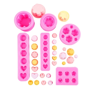Stampi in silicone rosa per budini, saponi e candele con forme di fiori e orsetti