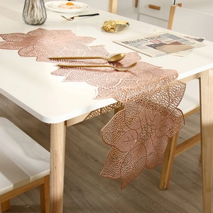 Rose gold hollowed floral PVC table runner with waterproof and heat resistant features