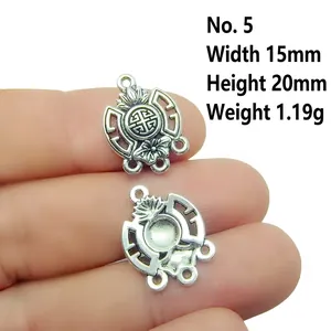 Macro shot of Tibetan silver hollow pendant with lotus pattern for DIY jewelry making