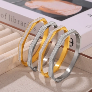 Elegant gold and silver octagonal titanium steel bracelets with pavé rhinestones display