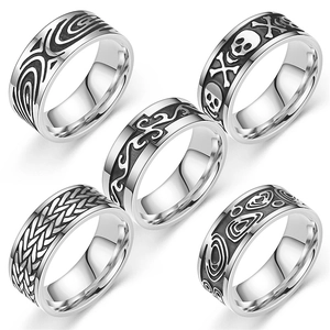 Vintage titanium steel rings for men featuring gothic skull and geometric carvings