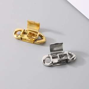Close-up of gold and silver folding flip clasp connectors for necklaces or bracelets