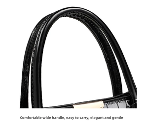 Close-up of black crocodile pattern faux leather handle with gold-tone hardware