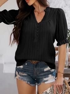 Detail of black textured V-neck top with flare half sleeves and button front design