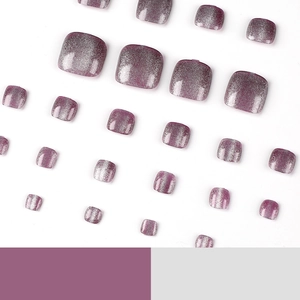 Cat eye purple press-on toenails with glitter shimmer effect in a full salon set