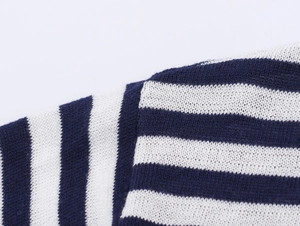 Close-up of the high-quality blue and white striped knit texture and fiber detail