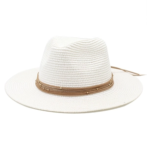 Detail of white straw fedora hat featuring woven texture and brown cord with gold beads