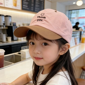 Detailed embroidery of smile and letters on breathable pink and brown baseball cap