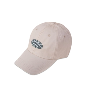 Detail of the high-density cotton fabric and green MYOB embroidery on the beige baseball cap