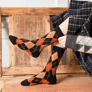 Vintage argyle wool blend crew socks in orange and black for winter warmth
