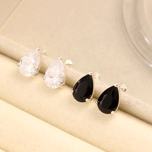 Detail of pear-cut zircon earrings in black and white on S925 silver studs