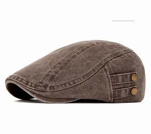 Detail of coffee color washed cotton beret with vintage bronze buckle accents