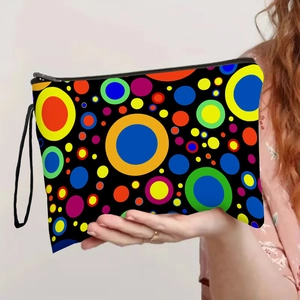 Handheld colorful polka dot makeup bag with black zipper and portable wrist strap