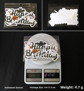 Detail of Halloween cake topper with Happy Birthday text, pumpkin and ghost motifs