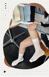 Detail of ultra-thin hollow mesh socks showing breathable diamond texture and five colors