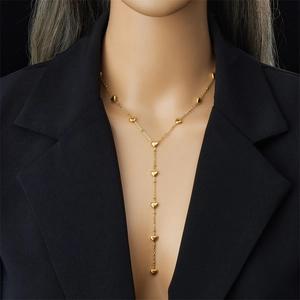 Elegant gold plated stainless steel Y-shaped necklace with heart charms on model