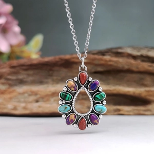 Bohemian silver necklace featuring a teardrop pendant with colorful turquoise and gemstones