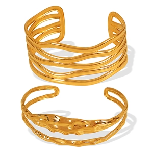 Elegant gold titanium steel bracelet set featuring multilayer wave and textured designs