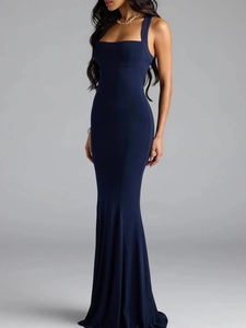 Close-up of deep blue mermaid evening gown showing slim fit cut and elastic matte fabric