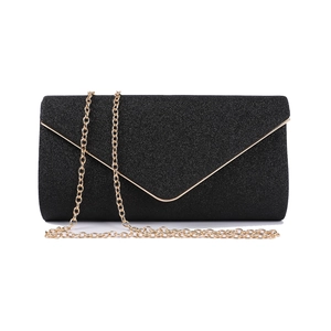 Close-up of black glitter evening clutch featuring a gold V-shaped trim and chain strap