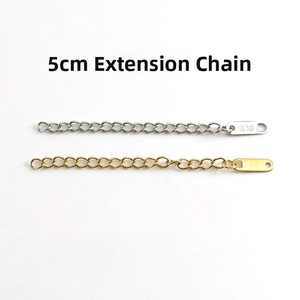 Close-up of 5cm gold and silver stainless steel extension chains with oval end tags