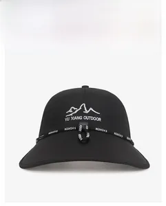 Detail of outdoor sun hat featuring mountain embroidery and adjustable windproof strap