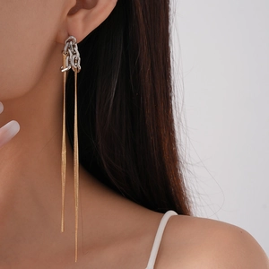 Minimalist gold and silver two-tone long metal chain tassel earrings for women worn by model