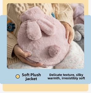 Detail of pink plush rabbit hot water bottle cover with long ears and soft faux fur texture