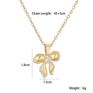 Detail view of 18K gold plated bow necklace with 45+5cm chain length and 6g weight