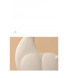 Close-up of minimalist white ceramic horse sculpture featuring elegant matte curved lines