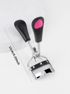 Detail of eyelash curler with comb showing 11cm length and heart pattern handle