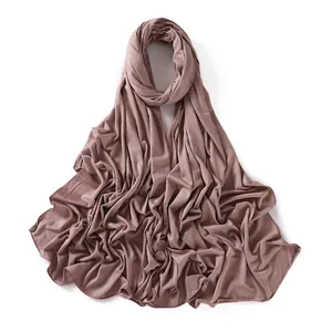 Detail of dusty pink modal jersey hijab scarf showing soft fabric and overlock edges