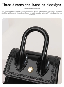 Detail view of black jelly handbag with V-shaped stitching and golden button closure