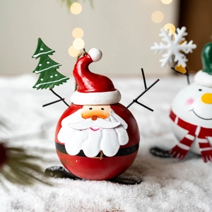 Christmas Santa iron ornament with red spherical body and rustic hanging twine