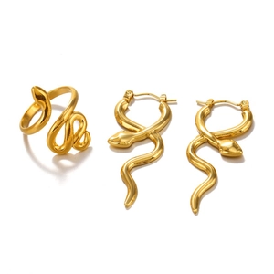 Polished golden snake-shaped earring and ring set in a minimalist vintage style